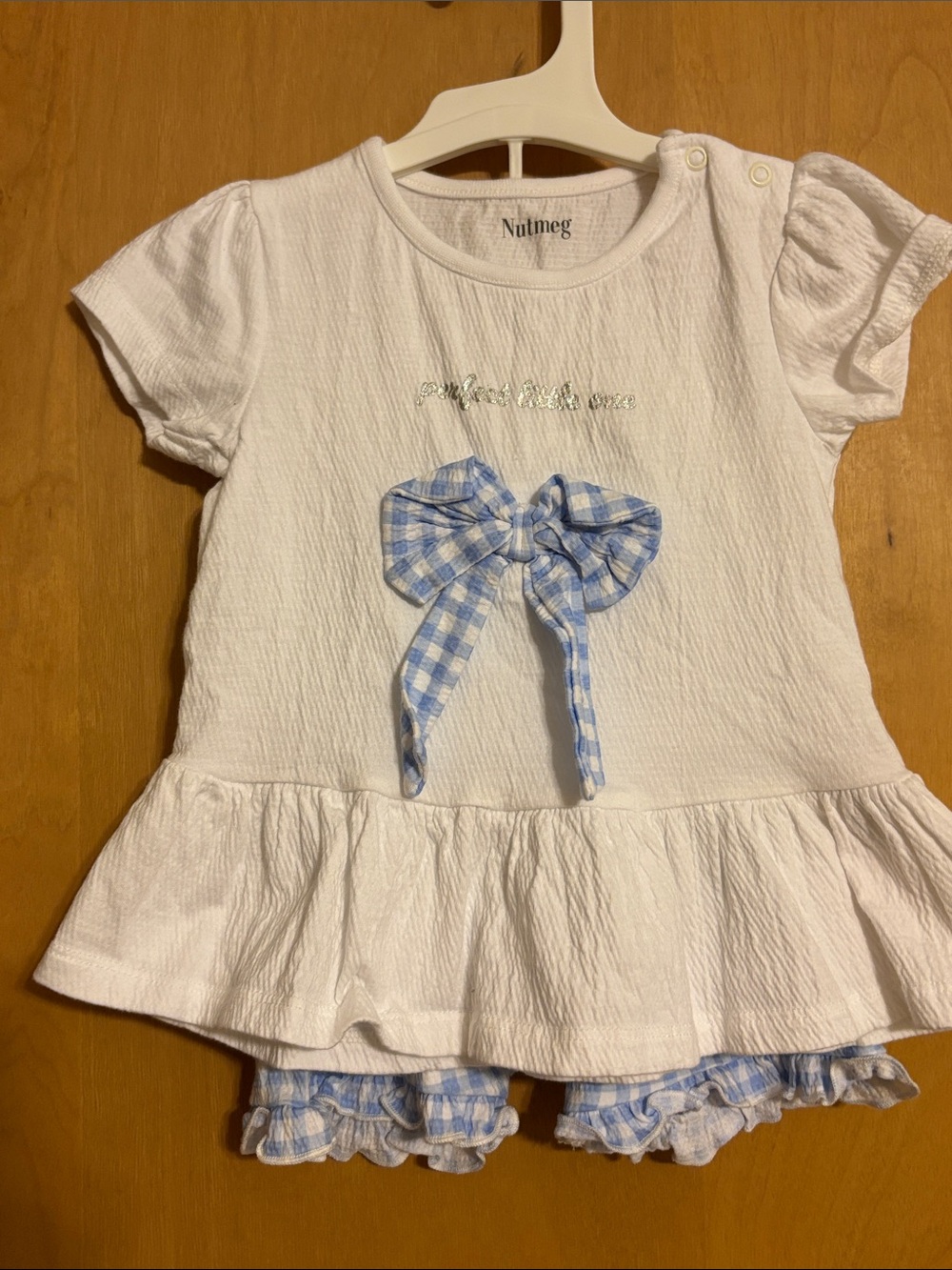 💙 3 FOR $22
Nutmeg White Girls' Peplum Tee with Blue Gingham Bow